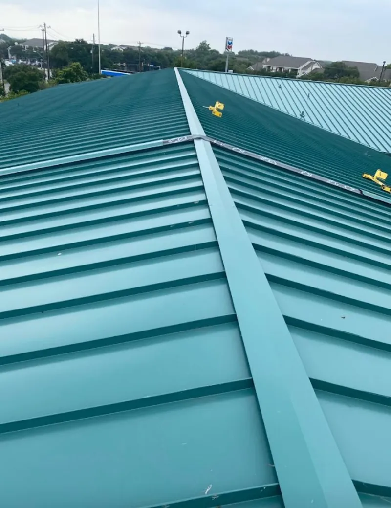 Green commercial metal roof ridge and valley for Metal Roof Repair in Allegany